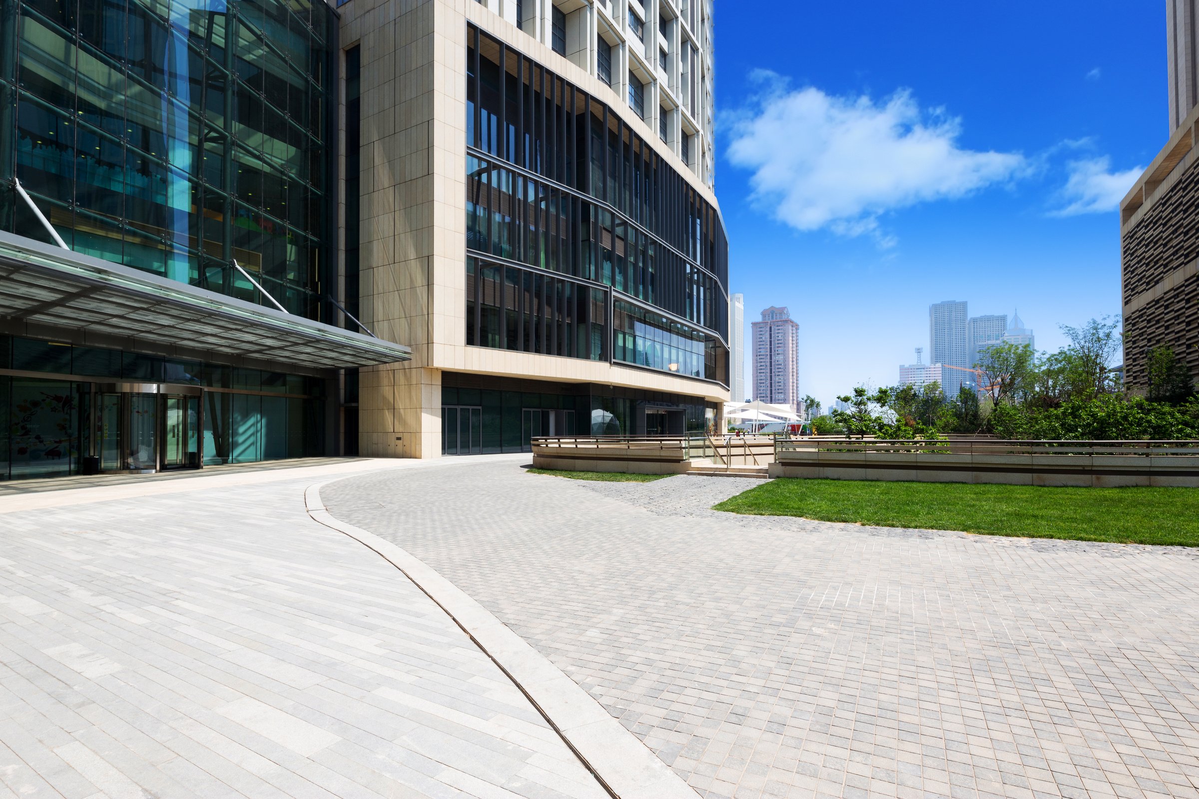 modern building exterior with brick road floor